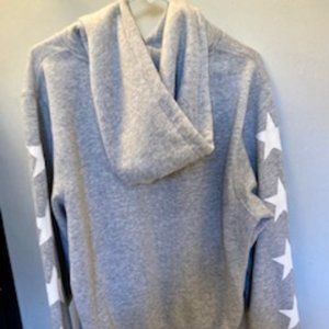 Reflex women's grey hoodie with white stars.